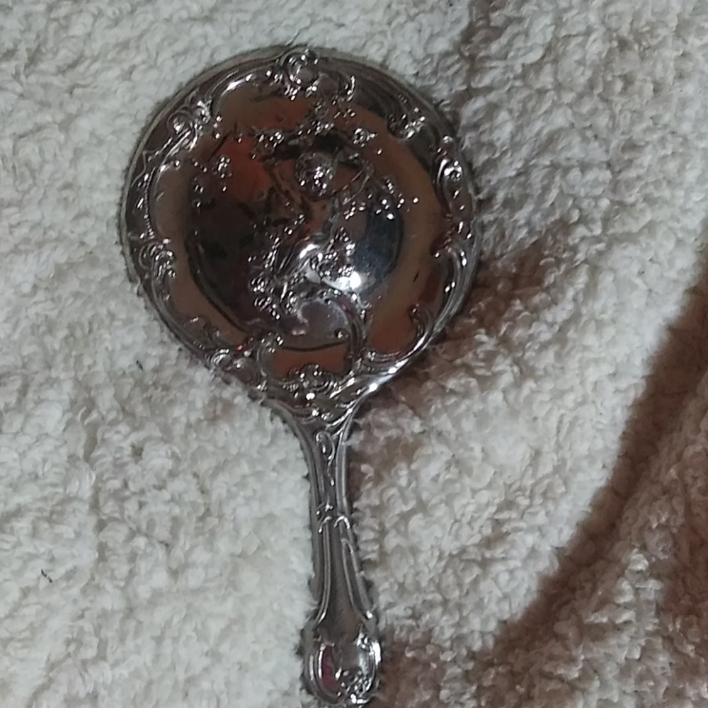 Vintage sterling silver cherub hand mirror